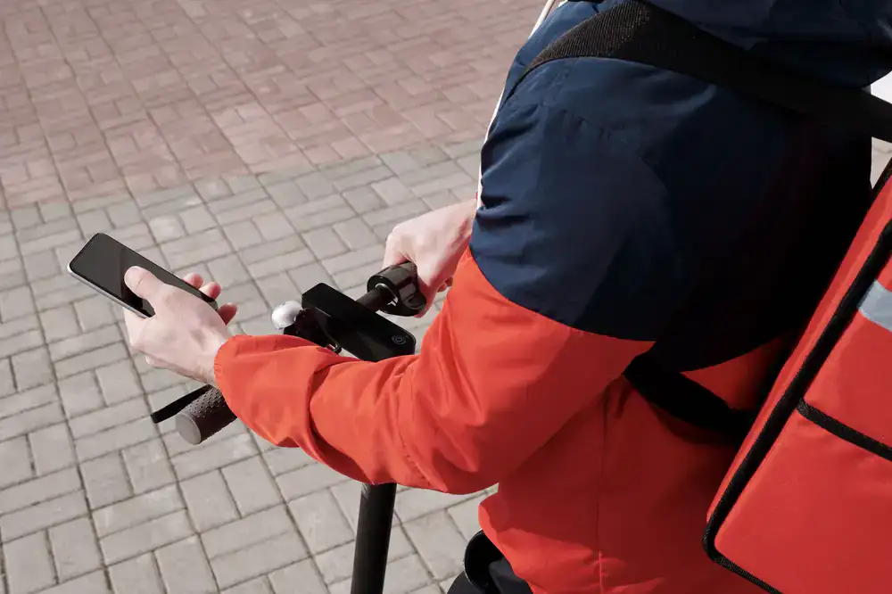 Courier looking at dispatch app
