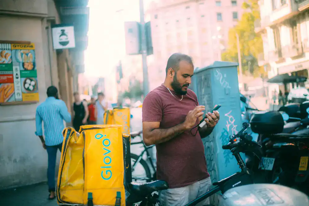 Bike courier checking delivery route